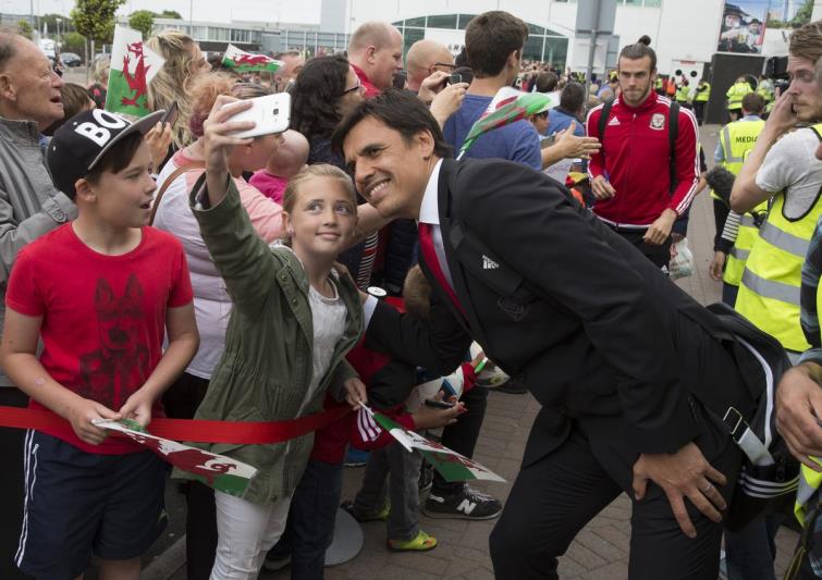 Chris Coleman has a selfie with a young fan